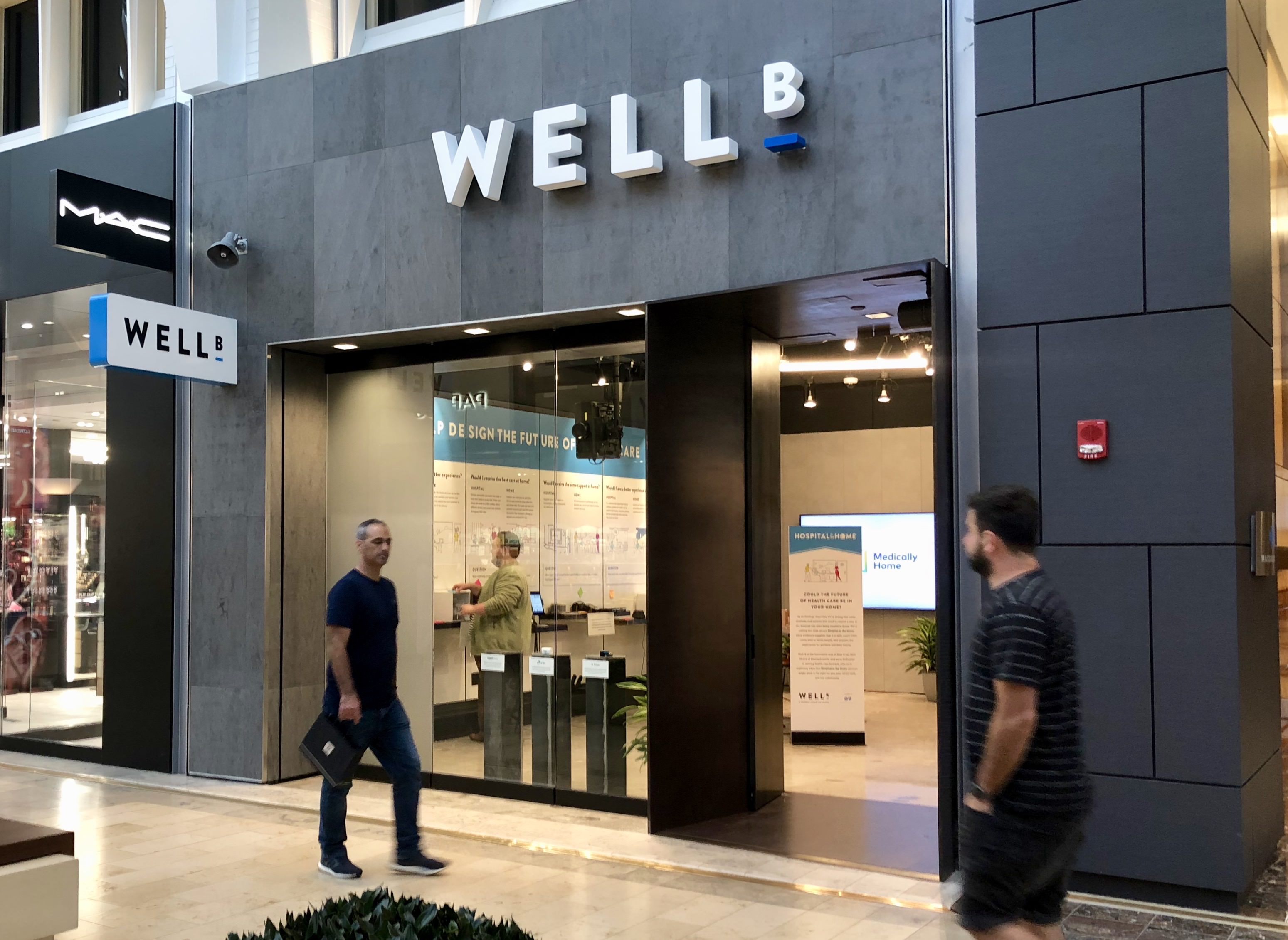 exterior view of Well_B retail/innovation space with people walking by