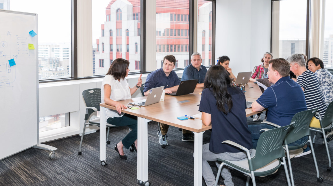 Cantina employees in a meeting room.