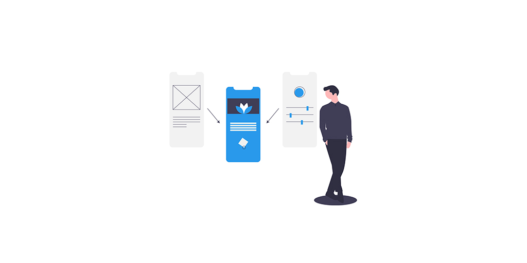 A man standing in front of three prototype screens.