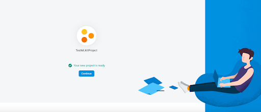 Firebase Project Ready Set Up Screen with split light grey/light blue background and person on beanbag with laptop working