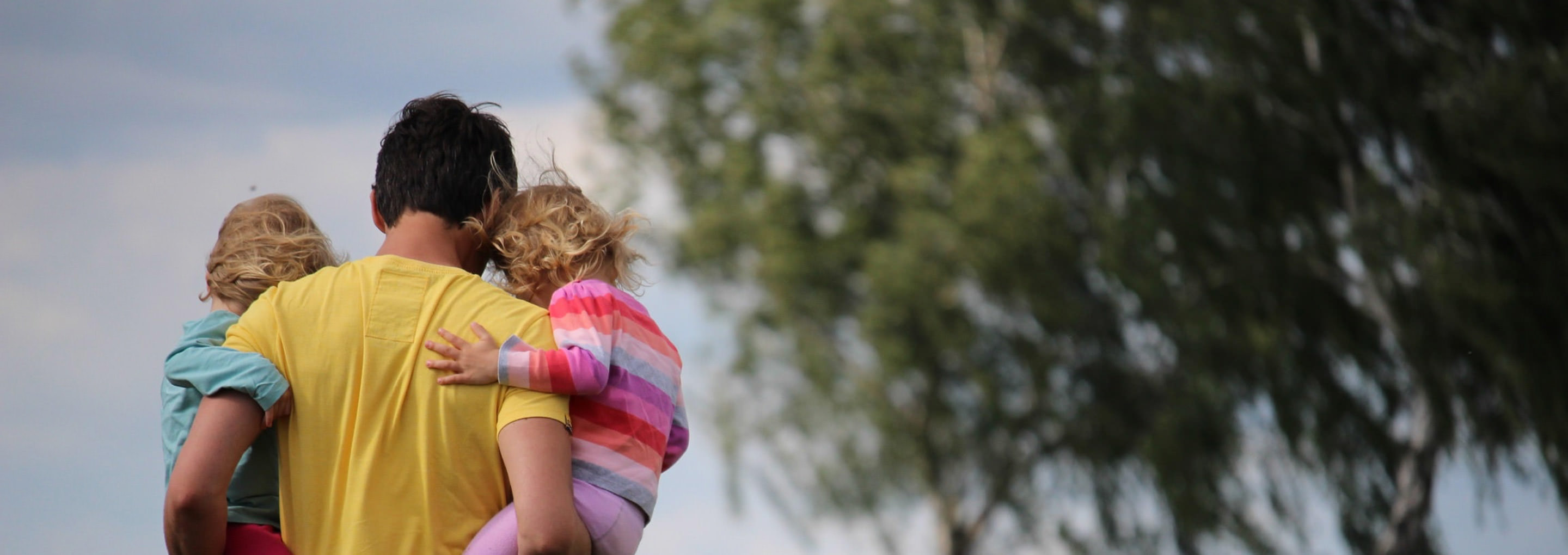 Parent holding children